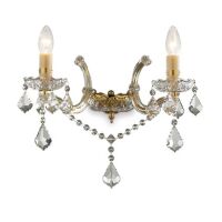 Kinkiet Florian AP2 ORO Ideal Lux 035659 metalowa oprawa w kolorze złotym podstawki z przezroczystego szkła ozdobiony jest zawieszkami z kryształków